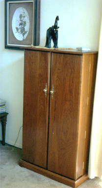 mahogany storage cabinet with doors closed