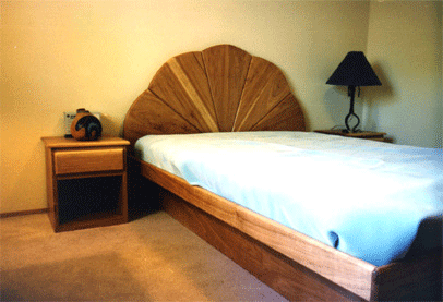 pecan platform bed, ornate headboard and matching bedisde